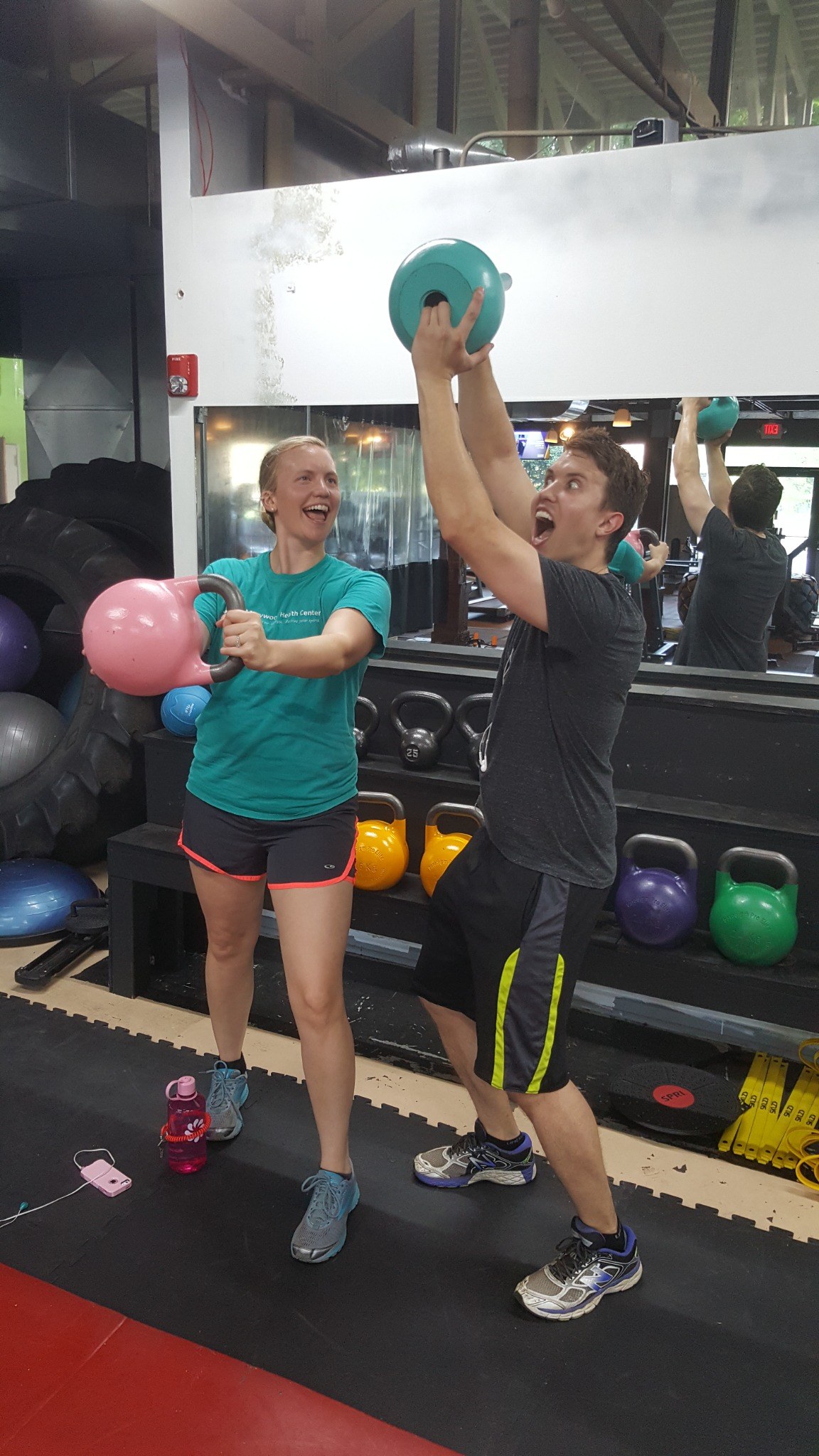 Members training with kettlebells at TKGym Four Lakes
